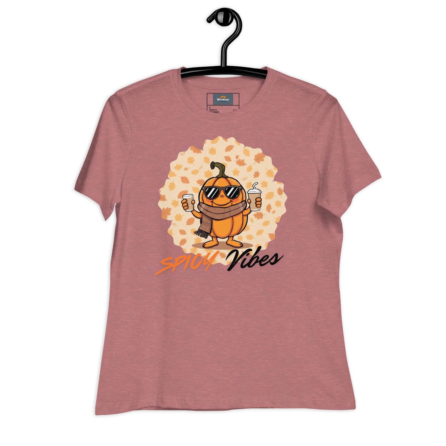 Image of a playful t-shirt featuring a cartoon pumpkin holding hot and cold pumpkin spice lattes with the "Spicy Vibes" tagline.