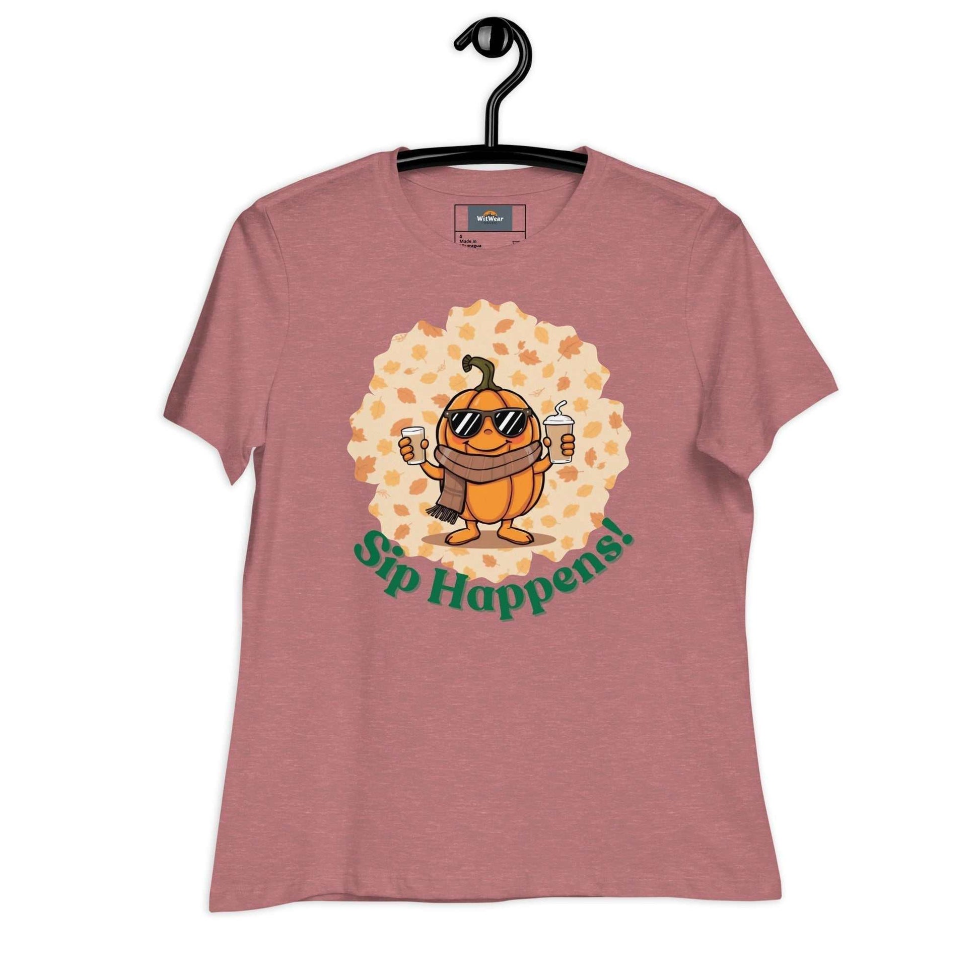 Image of a t-shirt with a cartoon pumpkin holding hot and cold Pumpkin Spice Latte T-Shirt, featuring the slogan "Sip Happens!" in playful font.