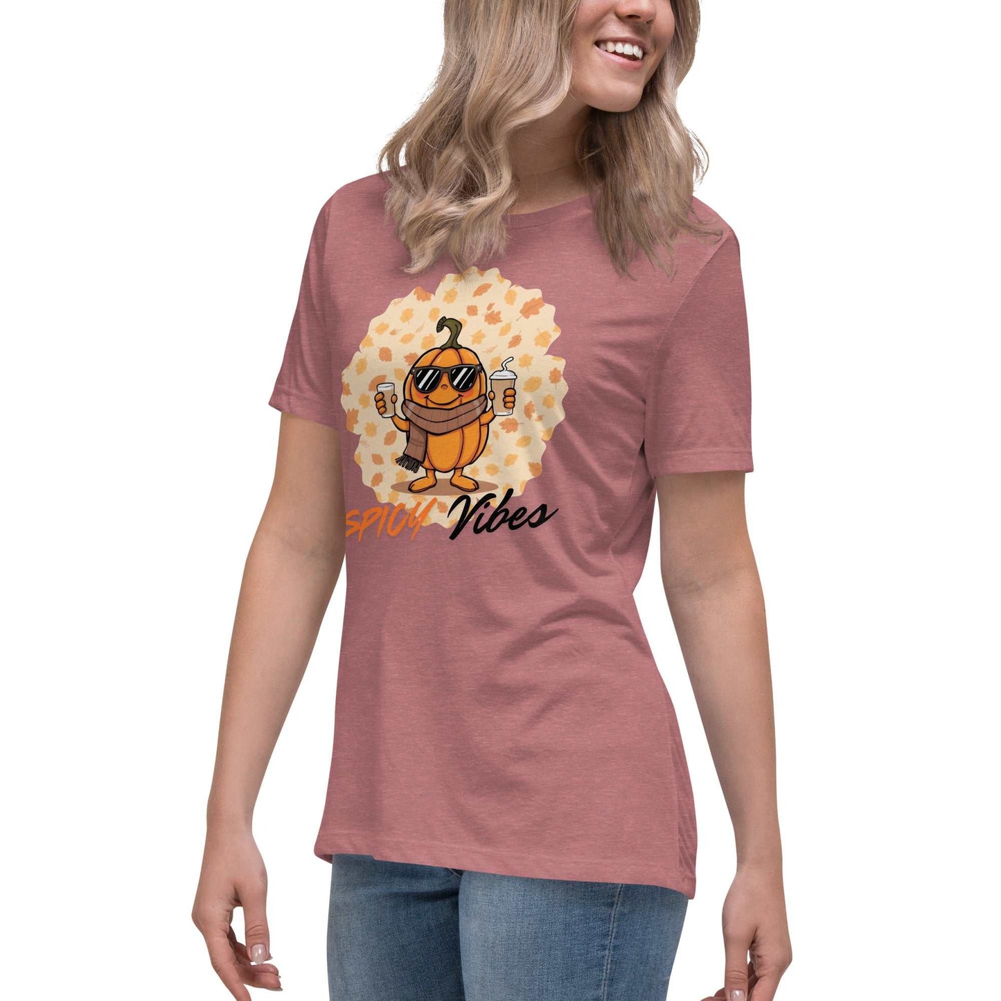 Image of a playful t-shirt featuring a cartoon pumpkin holding hot and cold pumpkin spice lattes with the "Spicy Vibes" tagline.