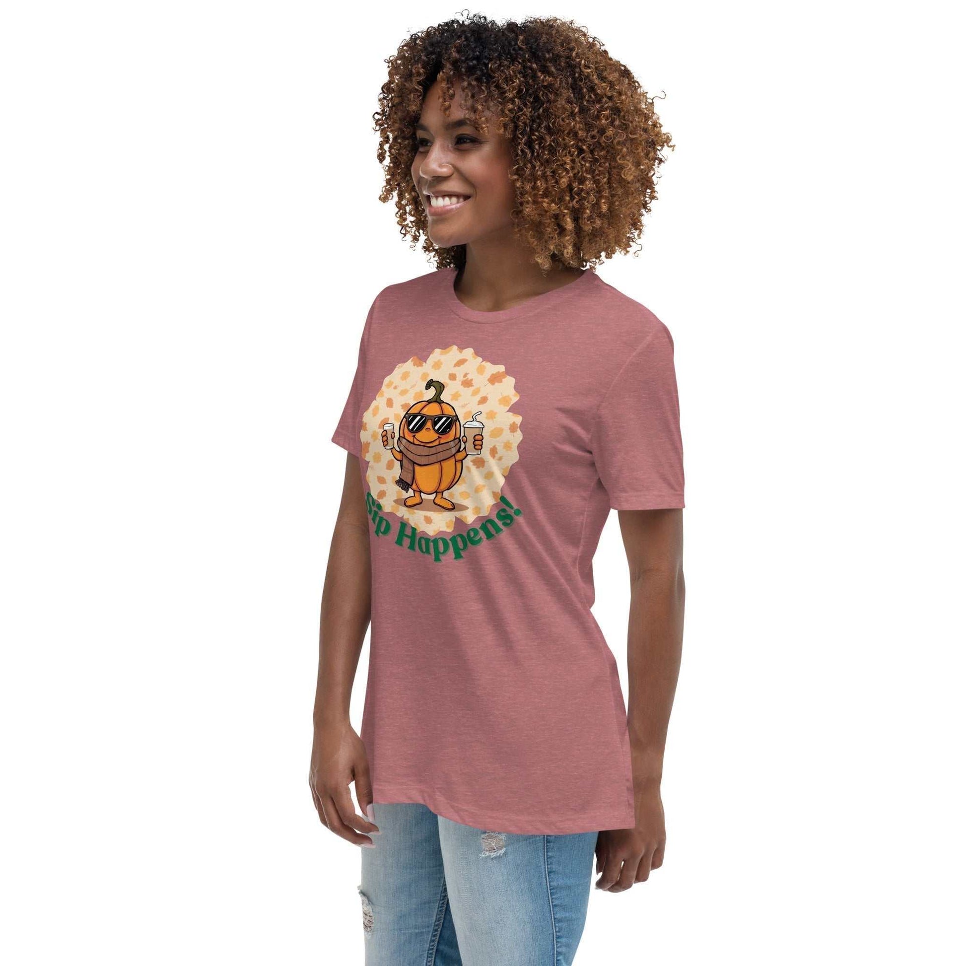 Image of a t-shirt with a cartoon pumpkin holding hot and cold Pumpkin Spice Latte T-Shirt, featuring the slogan "Sip Happens!" in playful font.