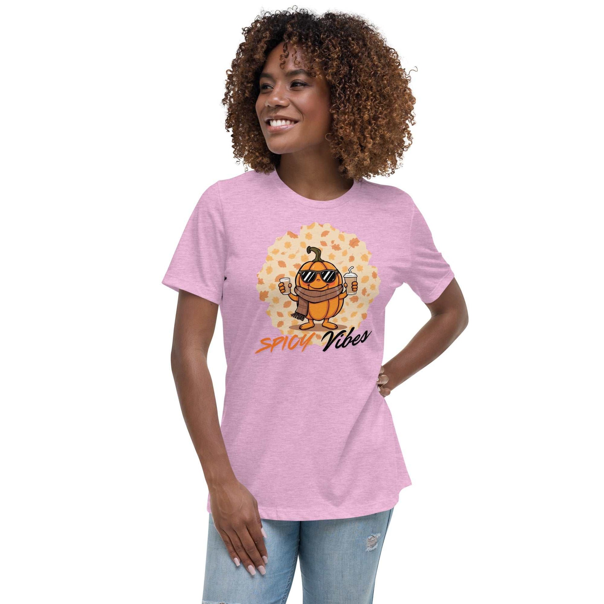 Image of a playful t-shirt featuring a cartoon pumpkin holding hot and cold pumpkin spice lattes with the "Spicy Vibes" tagline.