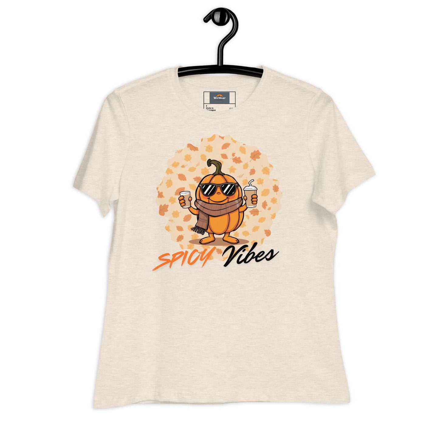 Image of a playful t-shirt featuring a cartoon pumpkin holding hot and cold pumpkin spice lattes with the "Spicy Vibes" tagline.